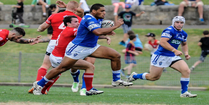 Newtown Jets front-rower Saulala Houma tears through the Illawarra Cutters defence at Henson Park on Saturday, with team-mate David Harris in close support.
