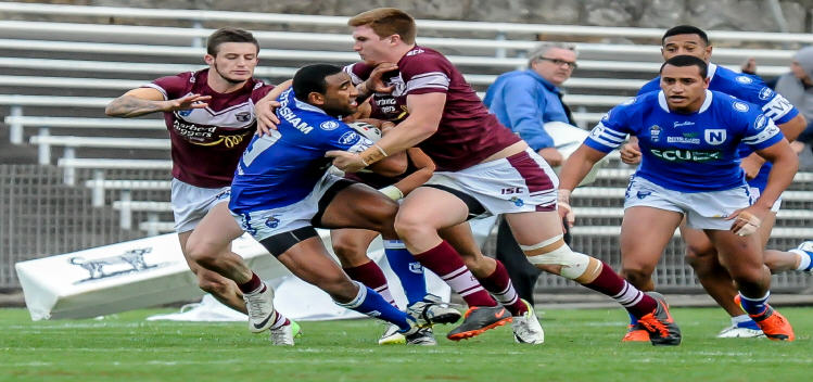 Newtown centre Samisoni Langi struggles with two Manly-Warringah defenders, with his Jets team-mates Sio Siua Taukeiaho and Tautau Moga in the background.
