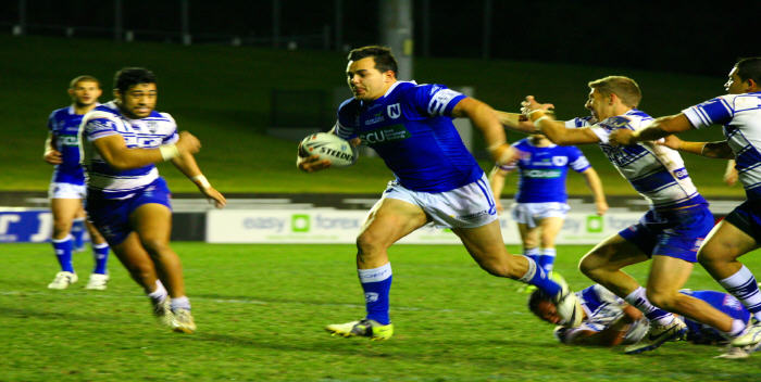 Barnstorming Newtown front rower and cult-hero Ryan ‘Rhino’ Verlinden on his way to scoring the first of two tries against the Bulldogs as partner-in-crime Ray Moujalli watches on. Both men proved a real handful for Canterbury in the Jets’ win.