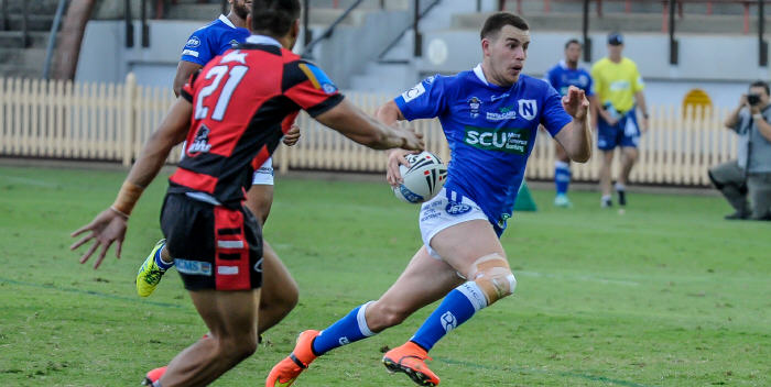 Newtown Jets five-eighth Dallas Wells accelerates to beat a North Sydney opponent at North Sydney Oval last Sunday. Photo:
Gary Sutherland Photography


