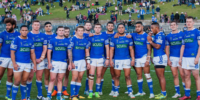 Kurt Kara and most of his Newtown Jets team-mates at the completion of his 100th NSW Cup match with Newtown RLFC.  Photo by Mario Facchini Photography
