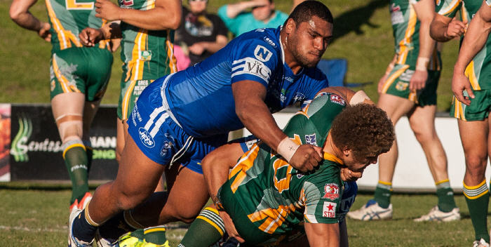 Man mountain Newtown Jets front-rower Saulala Houma makes short work of an unlucky Wyong Roos opponent last Sunday. Photo: Mario Facchini Photography

