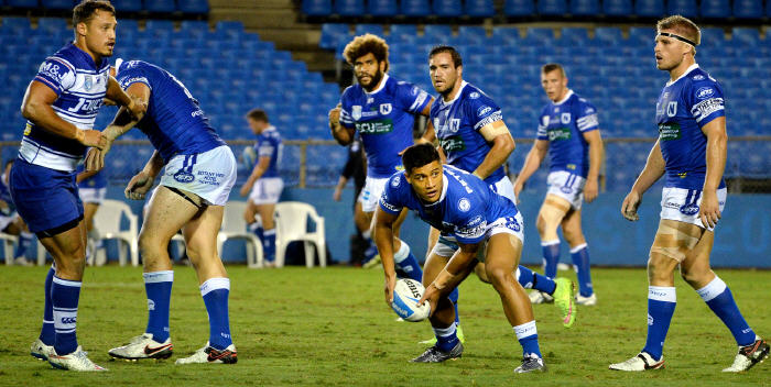 Newtown Jets halfback Fa'amanu Brown on dummy-half duty at Belmore Sports Ground on Friday night, with (from left) Junior Roqica, Jason Schirnack, Kurt Capewell and Matt McIlwrick nearest in the background. Photo: Michael Magee Photography.