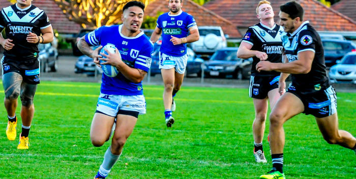 Newtown Jets five-eighth Jaline Graham cuts through the Wentworthville defence at Henson Park last Saturday, with team-mate and backrower Anthony Moraitis also in the picture. Photo:
Gary Sutherland Photography
