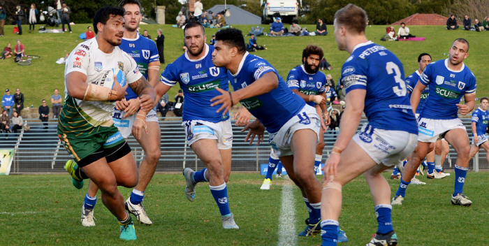 Newtown Jets forward and man of the match Malakai Houma gets set to demolish this Wyong Roos player at Henson Park last Saturday. Other Newtown Jets players in the photo (from left to right) are: Matt Evans, Jason Schirnack, Junior Roqica, Jordan Drew, Kurt Kara, Andrew Moraitis and Jacob Gagan. Photo: Michael Magee Photography.