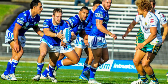 Newtown winger Matt Evans moves the ball forward in the first half against Wyong on Saturday, watched by Jets team-mates (from the left) Kurt Kara, Saulala Houma, Malakai Houma and Jason Schirnack. Photo: Gary Sutherland Photography.

