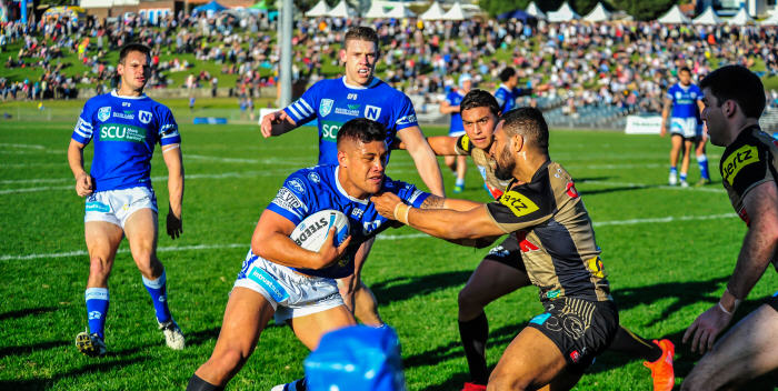 Newtown’s man of the hour … Jets halfback and Samoan international Fa’amanu Brown takes on the Penrith Panthers defence at Henson Park on Saturday, with team-mates Matt Evans (left) and Jacob Gagan in the near background. Photo: Gary Sutherland Photography
