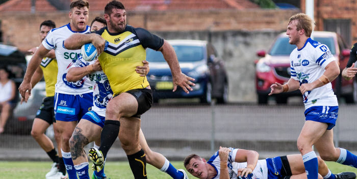 Newtown Jets defenders (from left) Jayden McDonogh, Ben Murray (obscured), Jaimin Jolliffe and Alec Bush have their work cut out as Mounties front-rower David “The Coal Train” Taylor makes a charge at Henson Park last Saturday. Photo: MAF Photography