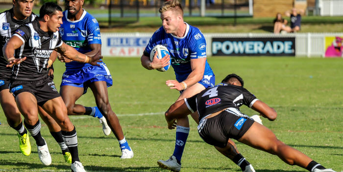 Newtown Jets centre Jordan Drew hits the ball up against Wentworthville on Sunday, with Edrick Lee in support. Photo: Gary Sutherland Photography
