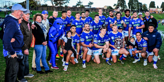 Members of Frank Hyde’s family joined with the victorious Newtown Jets team (and of course Jetman) after last year’s deciding match for the Frank Hyde Shield. Photo: Gary Sutherland Photography
