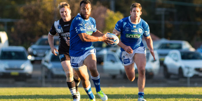 Newtown’s five-eighth Joseph Paulo takes the ball forward against Wentworthville at Henson Park on Saturday, with Jets front-rower Jeremy Latimore looming up in support. Photo: Mario Facchini (MAF Photography)
