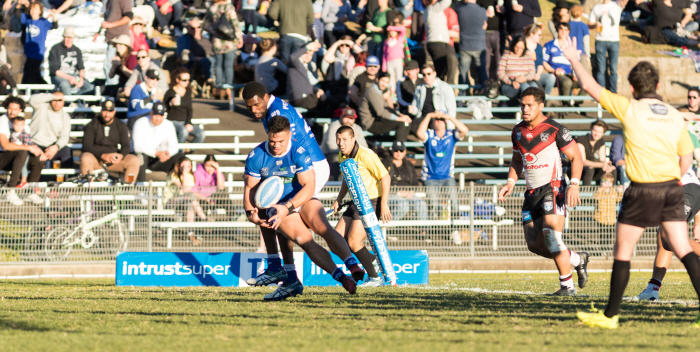 Newtown Jets centre Reubenn Rennie is pictured about to score in the 55th minute of last Saturday’s sensational victory against the New Zealand Warriors. Winger Edrick Lee is behind him. Photo: Mario Facchini (MAF Photography)

