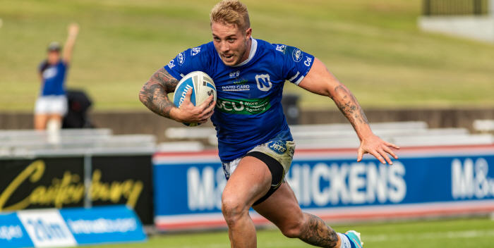 Newtown Jets centre Aaron Gray is pictured in full flight against the Canterbury Bulldogs at Belmore Sports Ground. Photo: Mario Facchini (MAF Photography)
