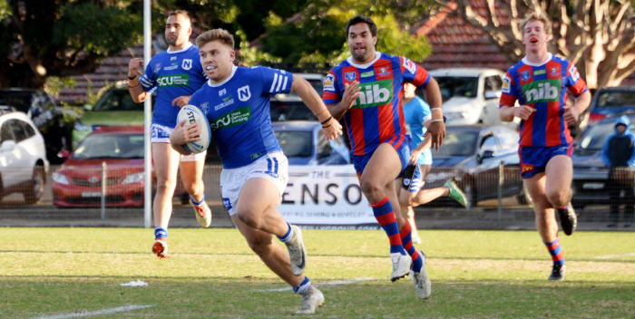 Newtown Jets and Scottish Rugby League World Cup centre Lachlan Stein shows a clean pair of heels to these Newcastle Knights defenders at Henson Park last Saturday. Photo: Michael Magee Photography.
