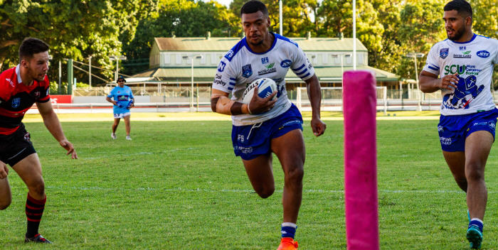 Newtown Jets centre Pio Nakubuwai has the try-line at his mercy in this shot from last Sunday’s Newtown versus North Sydney ISP NSW trial match at Wentworth Park. Pio has been signed for 2019 and previously played with the Melbourne Storm RLFC. Winger Chris Tupou, previously with the Cronulla Sharks, is the other Newtown Jets player in the photo. Photo: Mario Facchini, mafphotography
