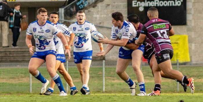 Newtown Jets backrower Royce Tout gets his pass away to Matt Jurd in last Saturday’s trial match against Blacktown Workers Sea Eagles played at Shark Park. Photo: Mario Facchini, mafphotography
