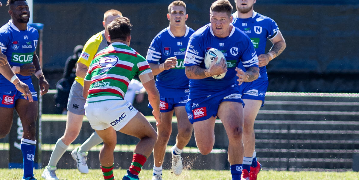 Newtown Jets lock Greg Eastwood is in possession in last Sunday’s South Sydney v Newtown match at the Metricon High Performance Centre (Redfern Oval). The Newtown players in the background are (from left) James Segeyaro (hooker), replacement five-eighth Luke Polselli and front-rower Daniel Vasquez. Photo: Mario Facchini, mafphotography
