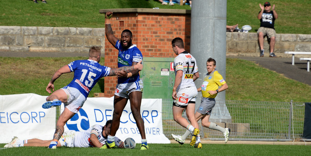 Newtown Jets winger Isaac Lumelume is jubilant after scoring early in the second half against Penrith last Sunday. Team-mate Aaron Gray (number 15) joins in the celebrations. Photo: Michael Magee Photography.