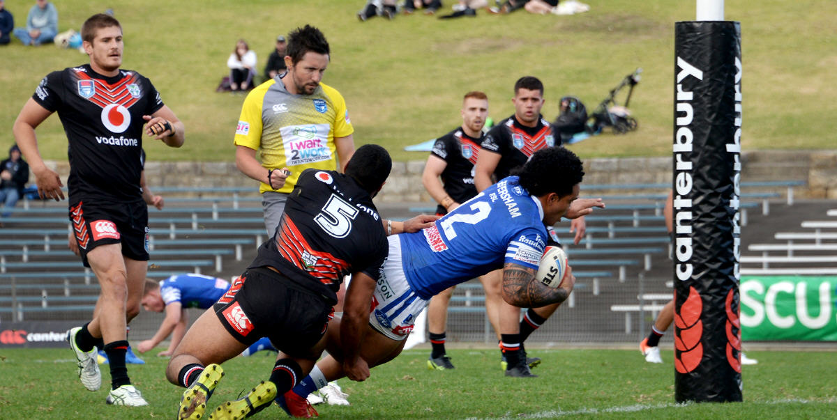 Newtown Jets second-rower Siosifa Talakai bursts through the New Zealand Warriors defence to score in the first half at Henson Park on Saturday. Photo: Michael Magee Photography.