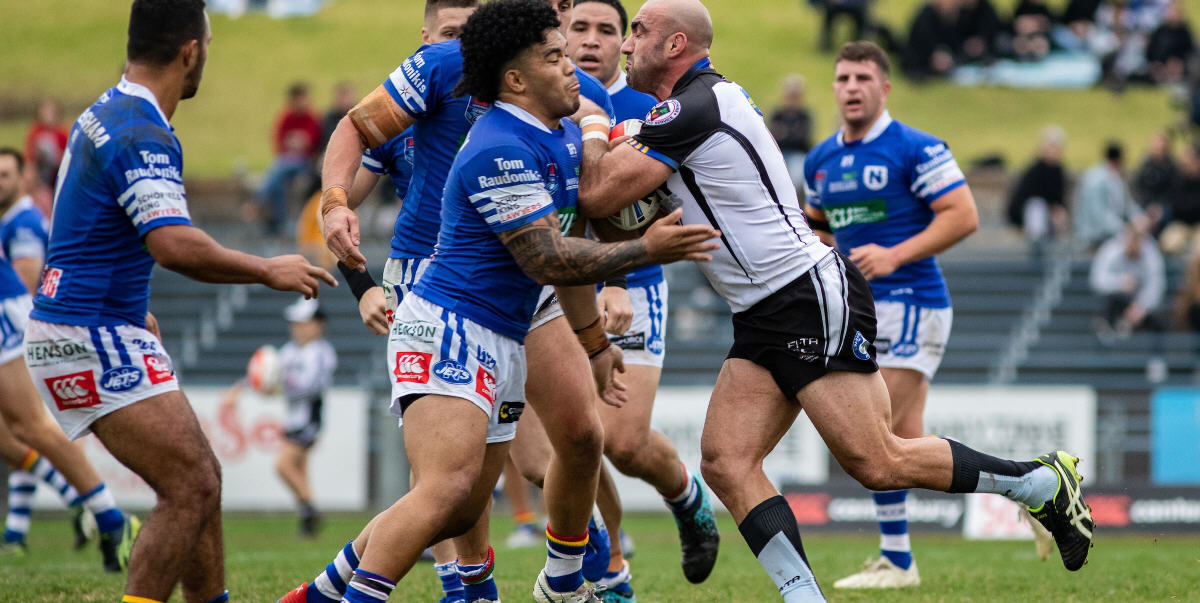 The Clash of the Juggernauts: Newtown backrower Siosifa Talakai gets ready to absorb the impact of Wentworthville’s Tim Mannah in the Canterbury Cup fixture played at Henson Park last Saturday. Photo: Mario Facchini, mafphotography