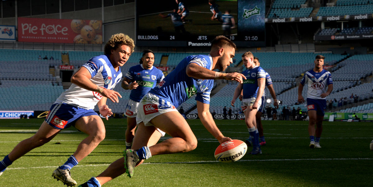 Newtown Jets fullback Will Kennedy scores his second try in the Canterbury Cup NSW fixture against Canterbury-Bankstown, played at ANZ Stadium on Sunday afternoon. Photo: Michael Magee Photography.