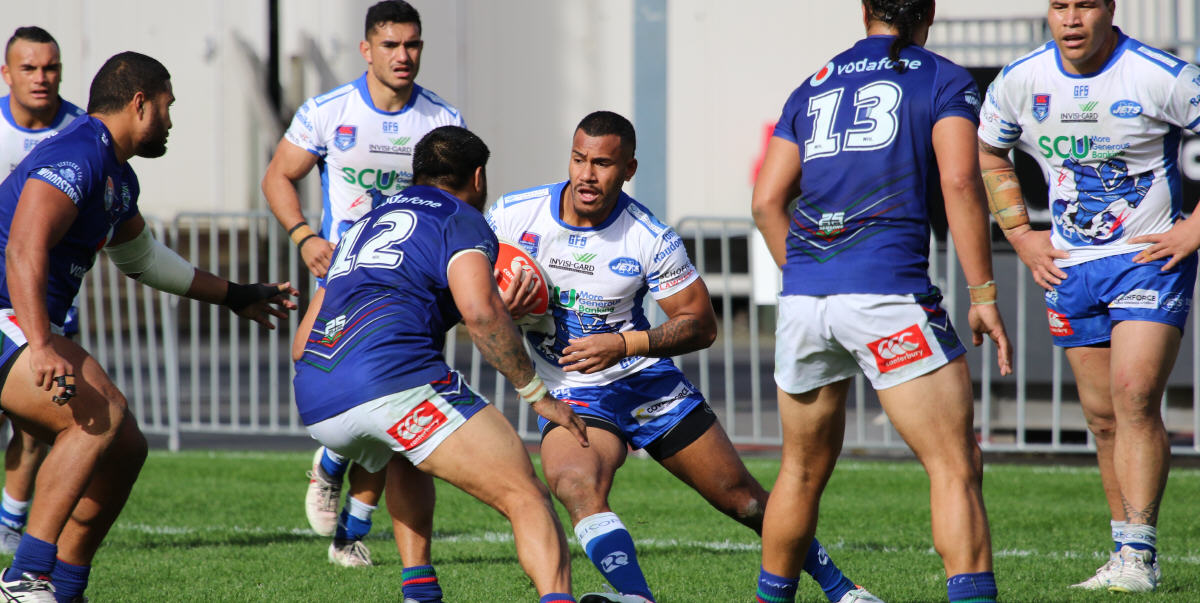 Newtown Jets winger Sione Katoa encounters a wall of New Zealand Warriors defenders in the Canterbury Cup NSW match at Mt Smart Stadium on Saturday. Photo:
FitographyNZ, Joe McPhee.
