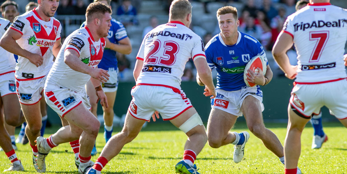 Newtown Jets back-rower Teig Wilton takes on a quartet of St George-Illawarra defenders in Sunday’s preliminary final. Photo: Mario Facchini, mafphotography