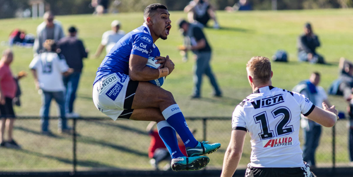 Newtown Jets winger Sione Katoa catches a Western Suburbs kick at Lidcombe Oval on Saturday. Photo: Mario Facchini, mafphotography