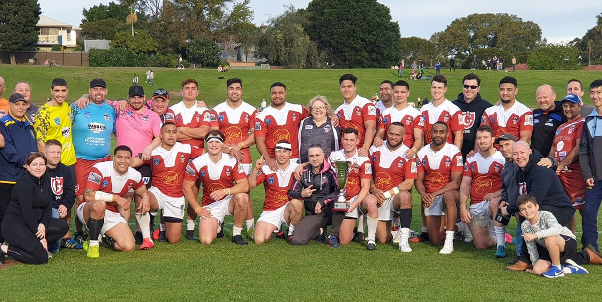 From out of the pages of rugby league’s history – the Glebe Dirty Reds players and staff celebrate their crushing 53-16 victory over Wentworthville in the NSWRL Challenge Cup Final played at Henson Park on Sunday. Photo: Supplied by the Glebe RLFC