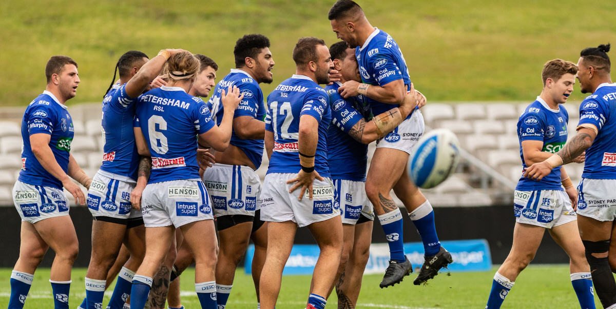 Newtown players celebrate after Wesley Lolo’s game sealing try during the NSWRL Intrust Super Premiership Finals week 2 match against Mounties at Jubilee Oval in Kogarah. Photo: Mario Facchini/mafphotography
