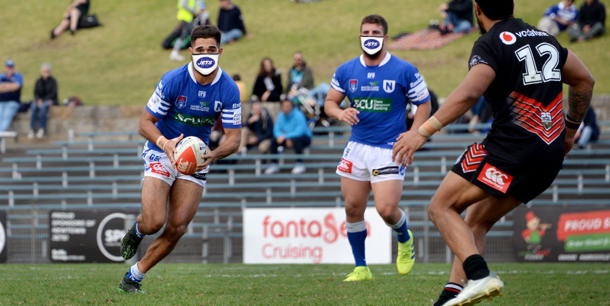 Take on the line in a Newtown Jets face mask. Photo: Mike Magee