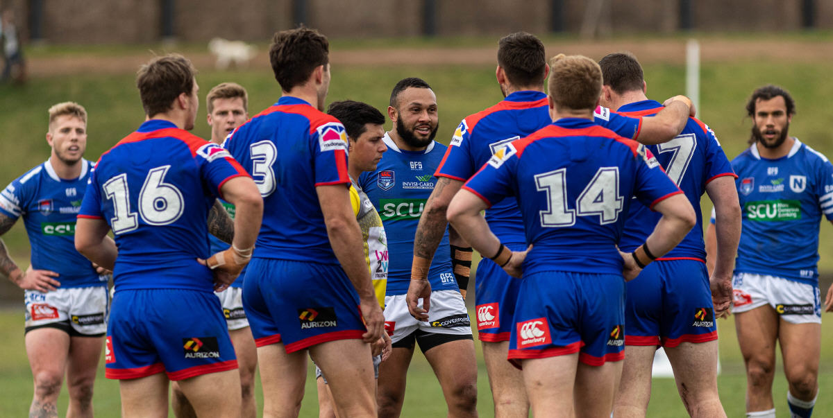 An ebullient Tyrone Phillips (centre of photo) has a few words to say to his Newcastle Knights opponents in the match played at Henson Park on the 31st August 2019.
Other Jets players facing the camera from the left are Aaron Gray, Teig Wilton and Toby Rudolf. Photo: Mario Facchini, mafphotography
