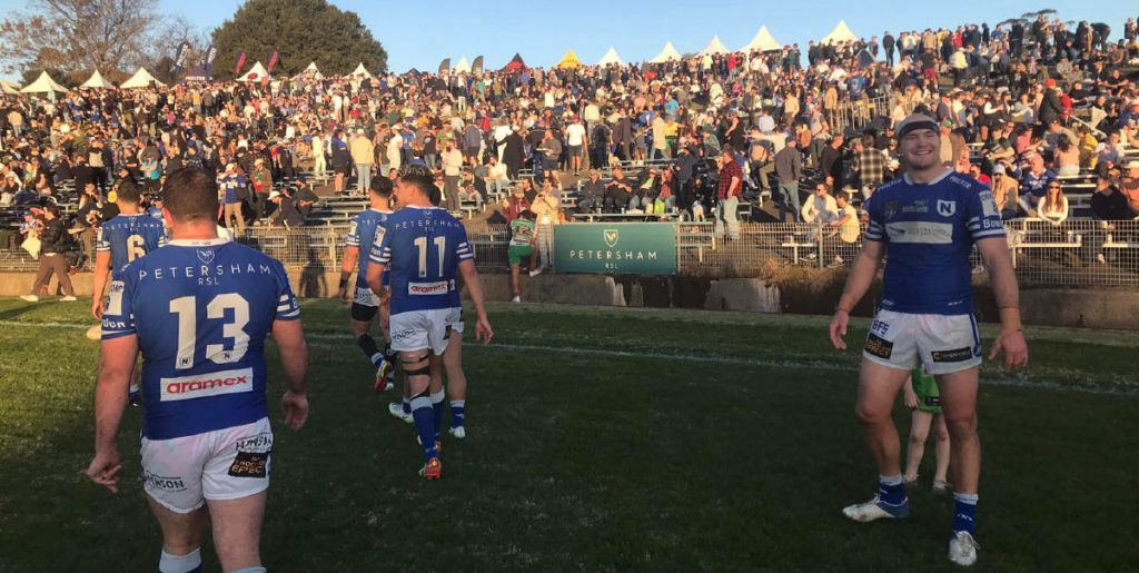 Big Newtown prop Tommy Hazelton (on the right) soaks up the post-game Festival atmosphere  after fulltime on Saturday. (Facebook)