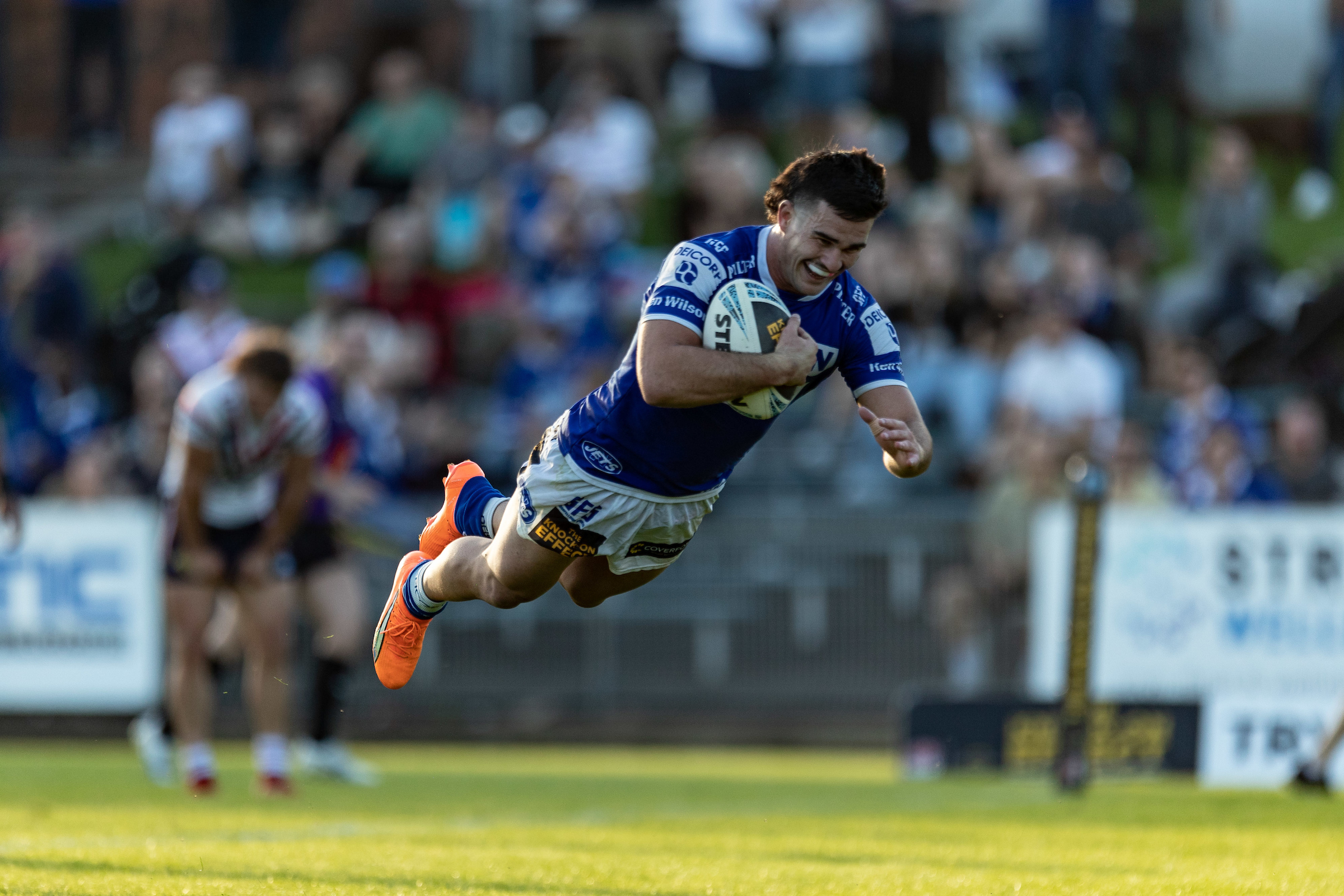 Daniel Atkinson scores against the Roosters. (Mario Facchini/mafphotography)