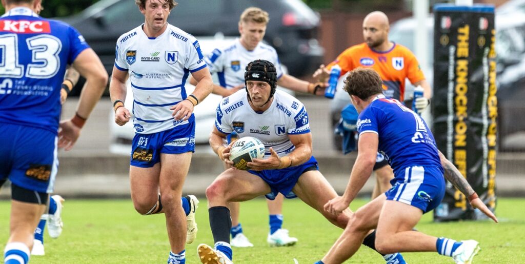 Jets winger Tom Rodwell in possession, with back-rower Kyle Pickering on the left of the photo. Hoto: Mario Facchini, mafphotography