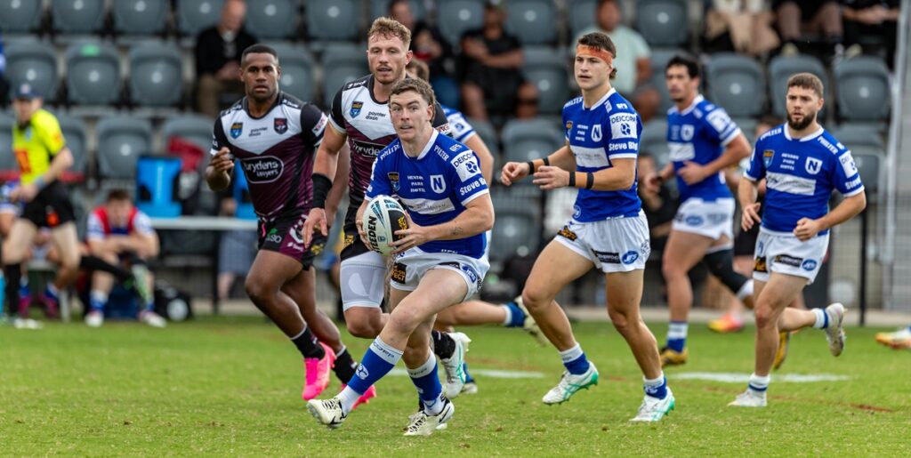 Newtown Jets fullback Kade Dykes (in possession) was in superb form on Sunday, scoring three tries, including the winning try in the last ninety seconds of the game. Other Newtown players in the photo are (from the left) Sam Healey, Jackson Ferris and Khaled Rajab. Photo: Mario Facchini/mafphotography
